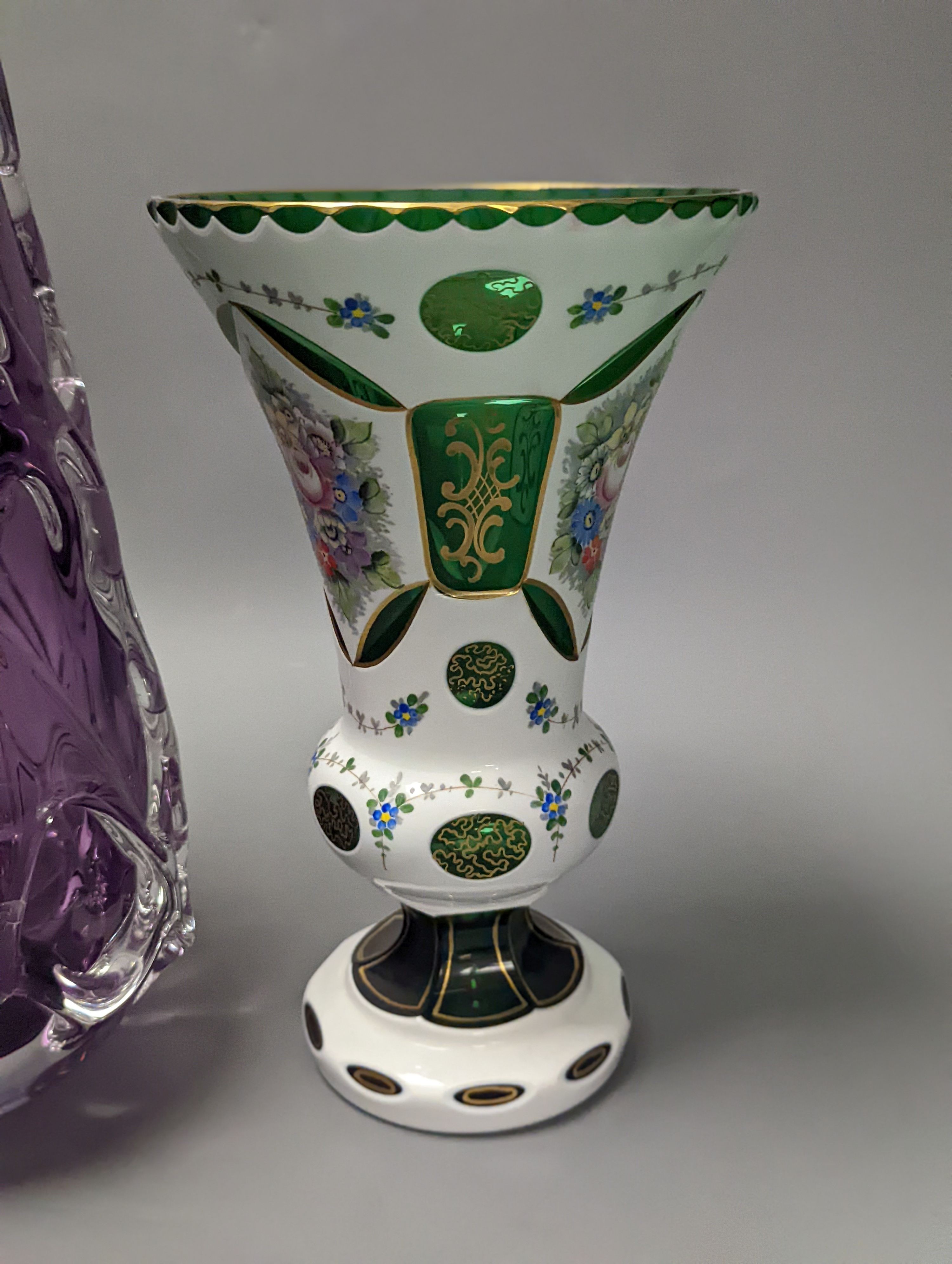 An amethyst art glass vase and Bohemian overlaid green glass vase 34cm